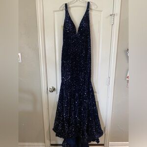 Sherri Hill style #55084. Open back, sequin, dark blue, v- neck formal dress